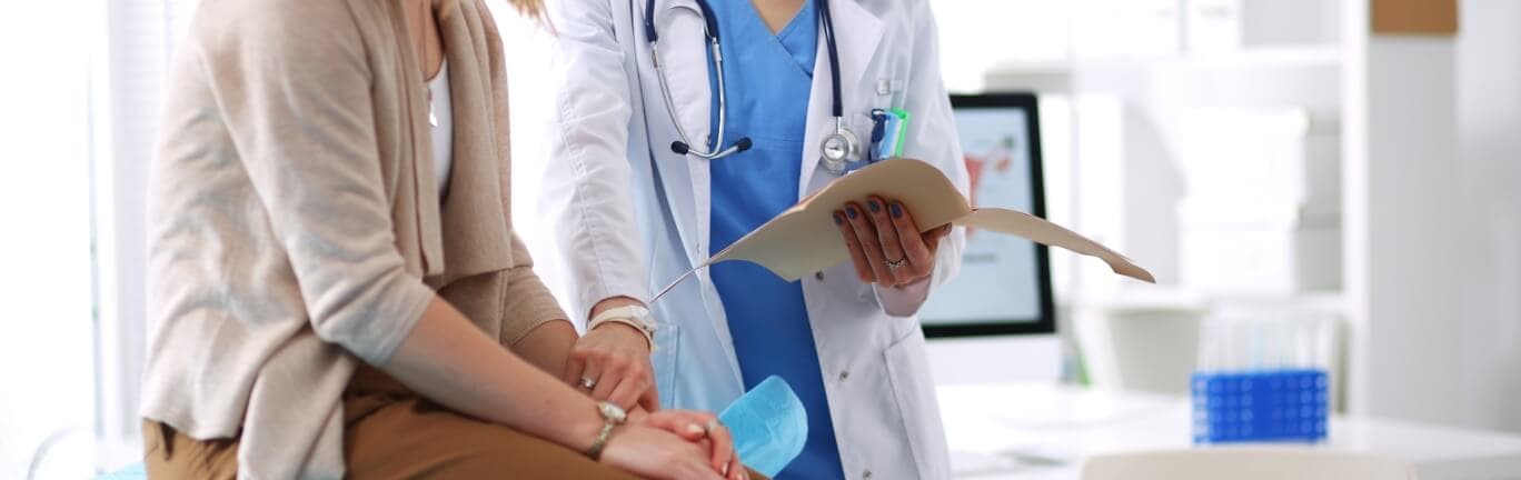 Doctor going over VONVENDI® documents with her patient.