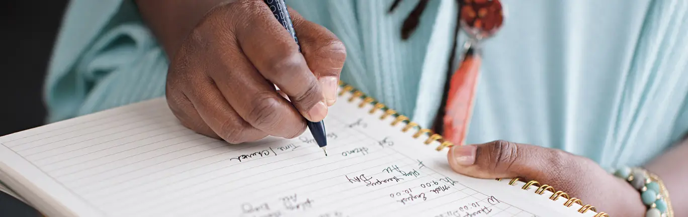 Erica, a VONVENDI patient, writing notes in her journal.