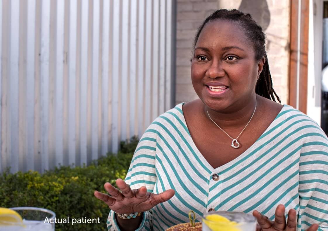 Erica, a real VWD patient having a discussion at a table.