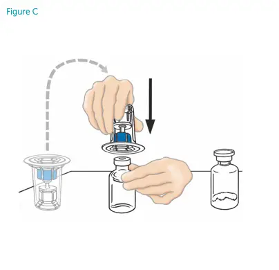 Hands connecting the Mix2Vial device on top of the diluent vial stopper.